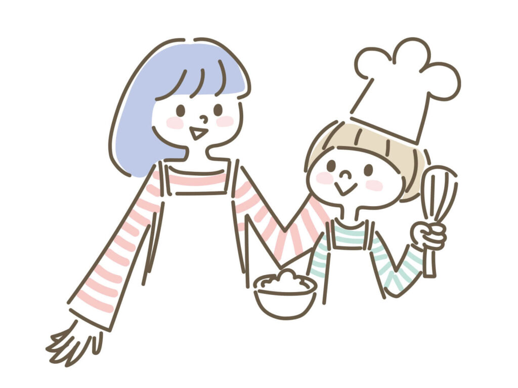 子供と料理をするママ